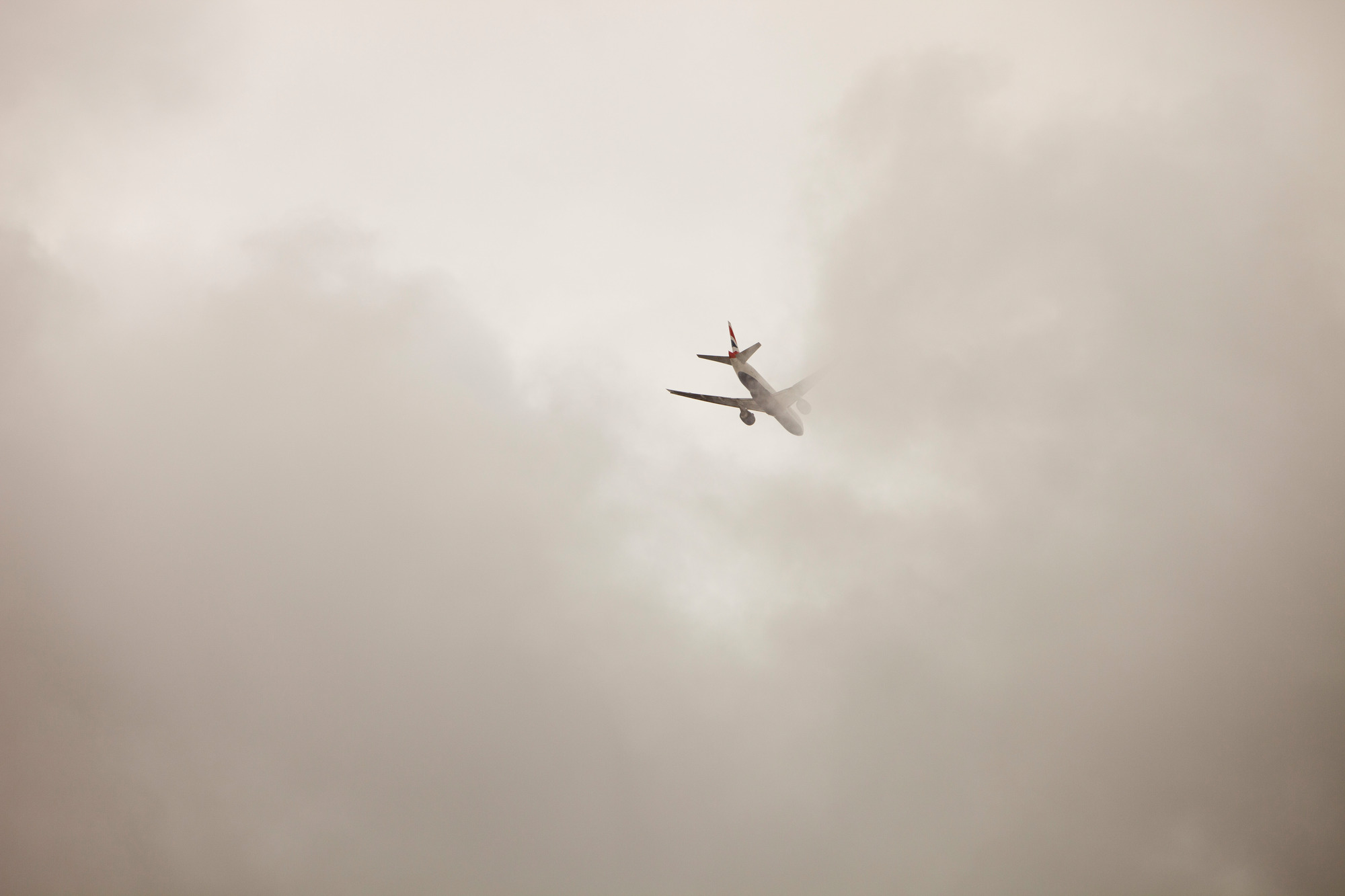 A plane flying into cloud over London - © Global Warming Images / WWF A plane flying into cloud over London