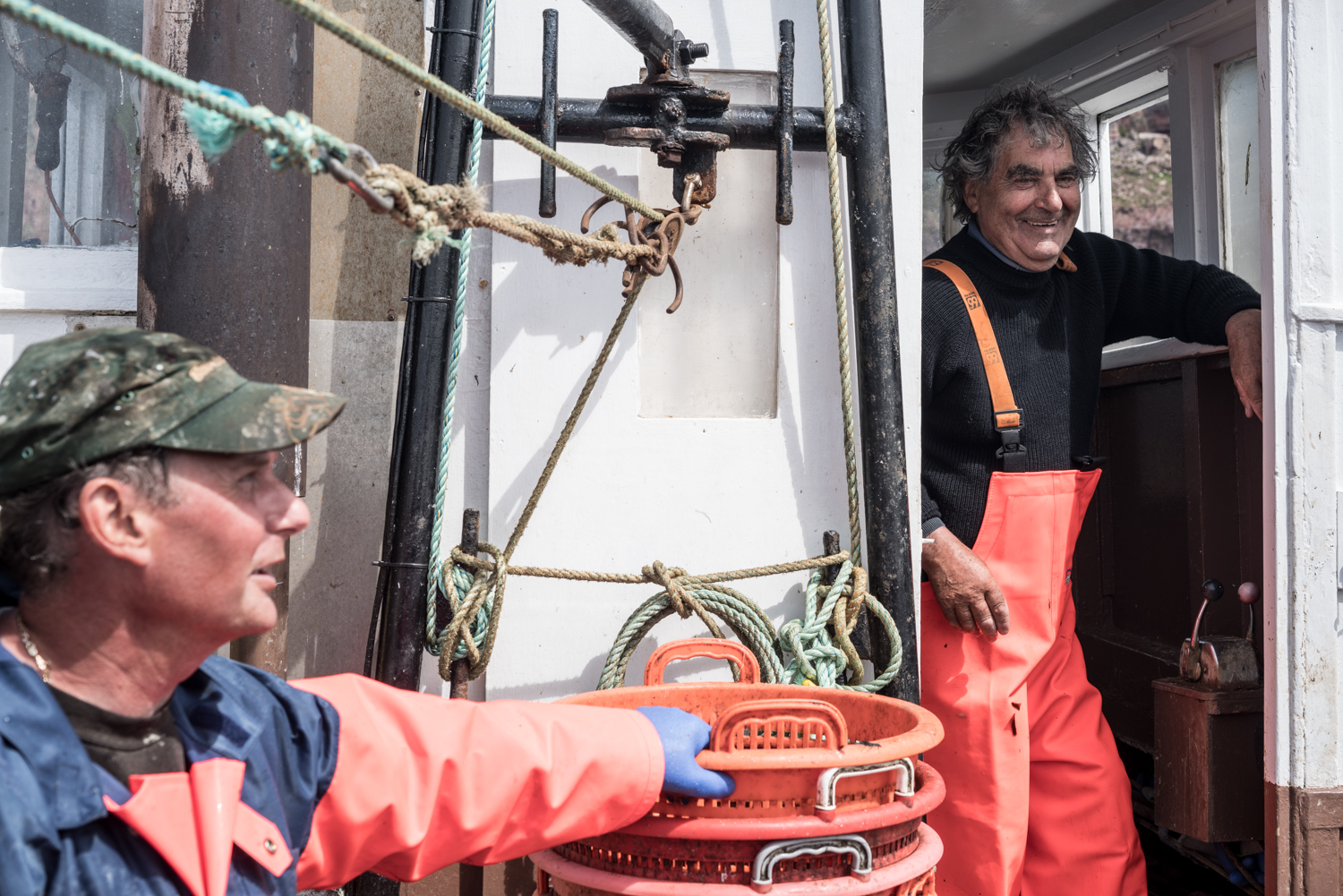 Fishermen on a boat off the Scottish coast - © Anthony Dickenson Fishermen on a boat off the Scottish coast