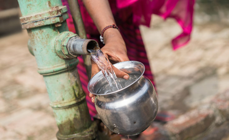 A woman fetches water from a well © Thomas Cristofoletti / Ruom for WWF-UK A woman fetches water from a well