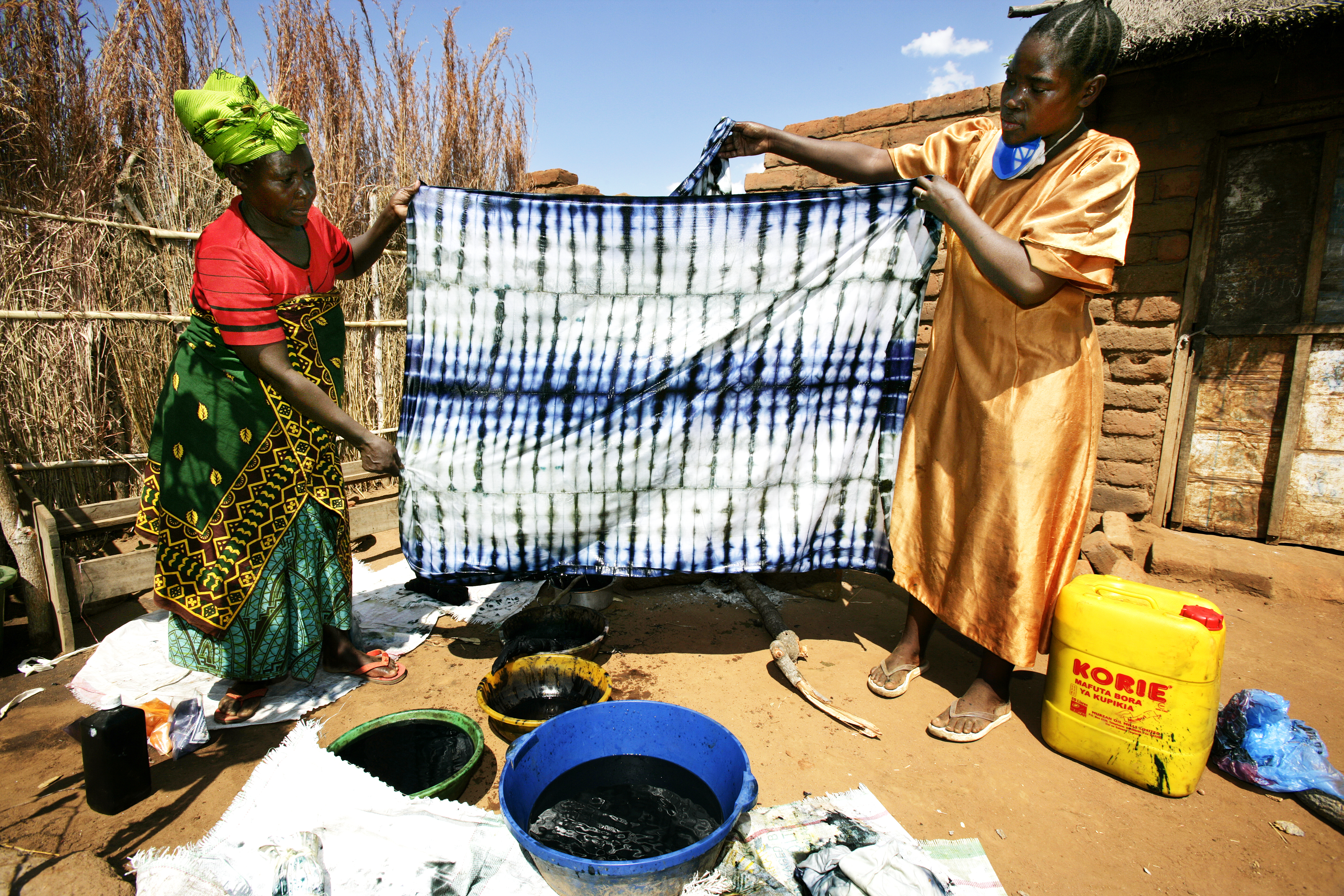VICOBA members creating batik fabrics image, one of the alternative businesses the banks help to finance. Credit: Brent Stirton/Getty images/WWF UK VICOBA members creating batik fabrics image, one of the alternative businesses the banks help to finance. Credit: Brent Stirton/Getty images/WWF UK