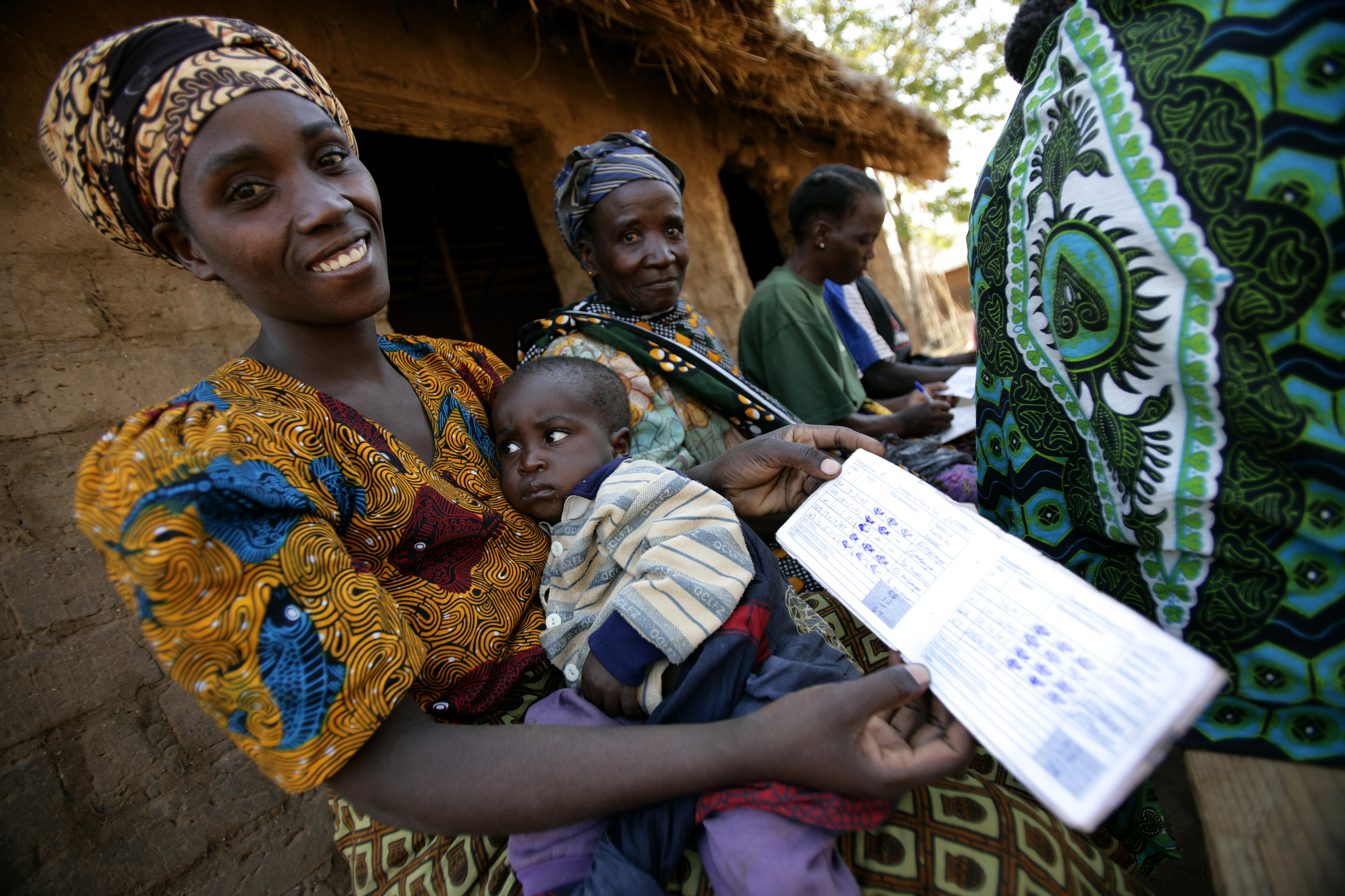 A member of VICOBA in Tanzania shows her savings book A member of VICOBA in Tanzania shows her savings book