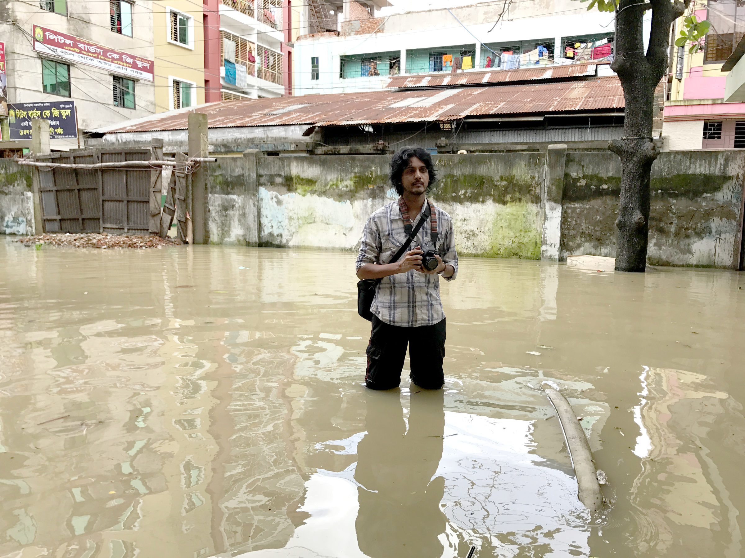 Jashim Salam, working in the floodwater. Chittagong, Bangladesh. Jashim Salam, working in the floodwater. Chittagong, Bangladesh.