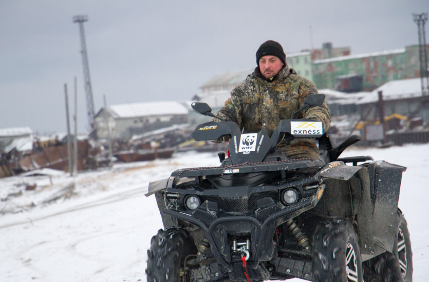 Yuri Popovich patrolling on a quad bike, Amderma, Russia