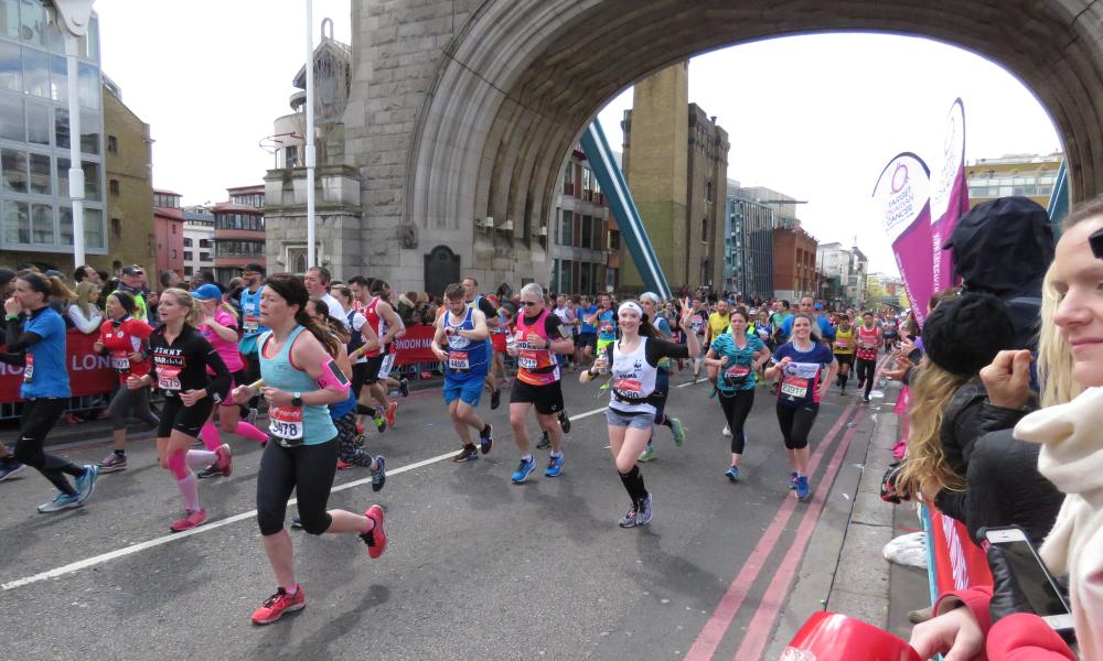 Runner at London Marathon on the bridge