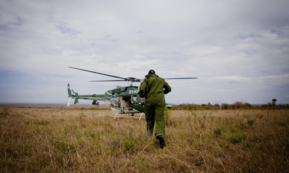 Vets boarding helicopter to go and dart rhinos Thumbnail