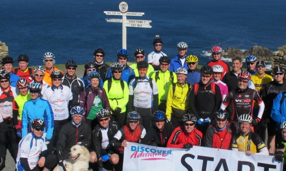Cyclists at John O'Groats Cyclists at Land's End group photo