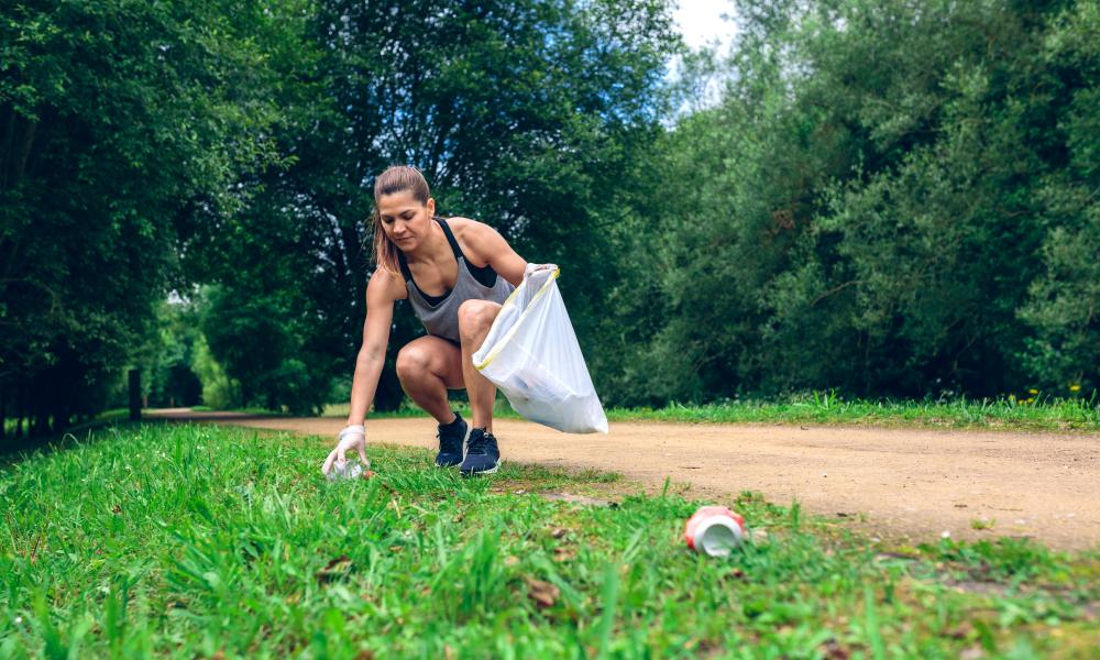 Women picking up litter and jog