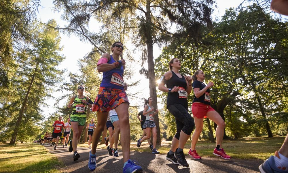 Runners in Kew Gardens with trees