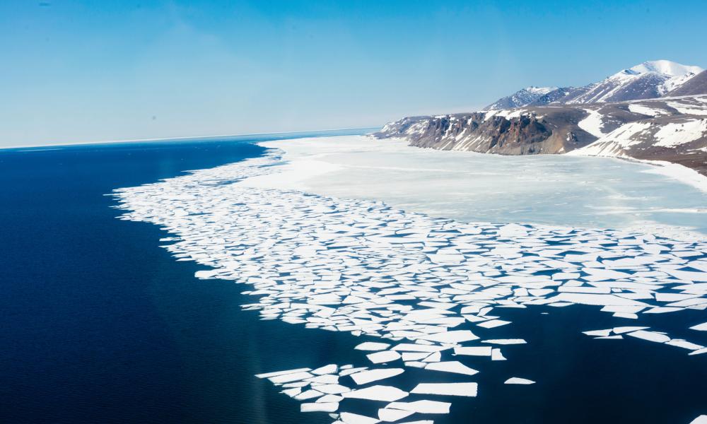 Aerial view of the shoreline of melting ice along the Bering Strait, Wales, Alaska, United States.