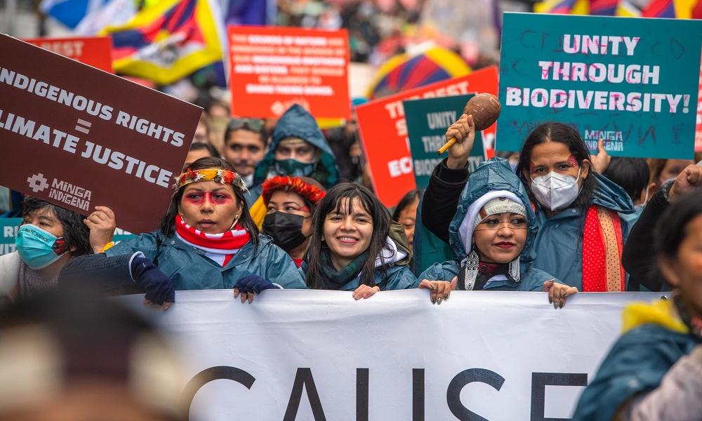 Txai Surui and other indiginous people march towards Glasgow Green.