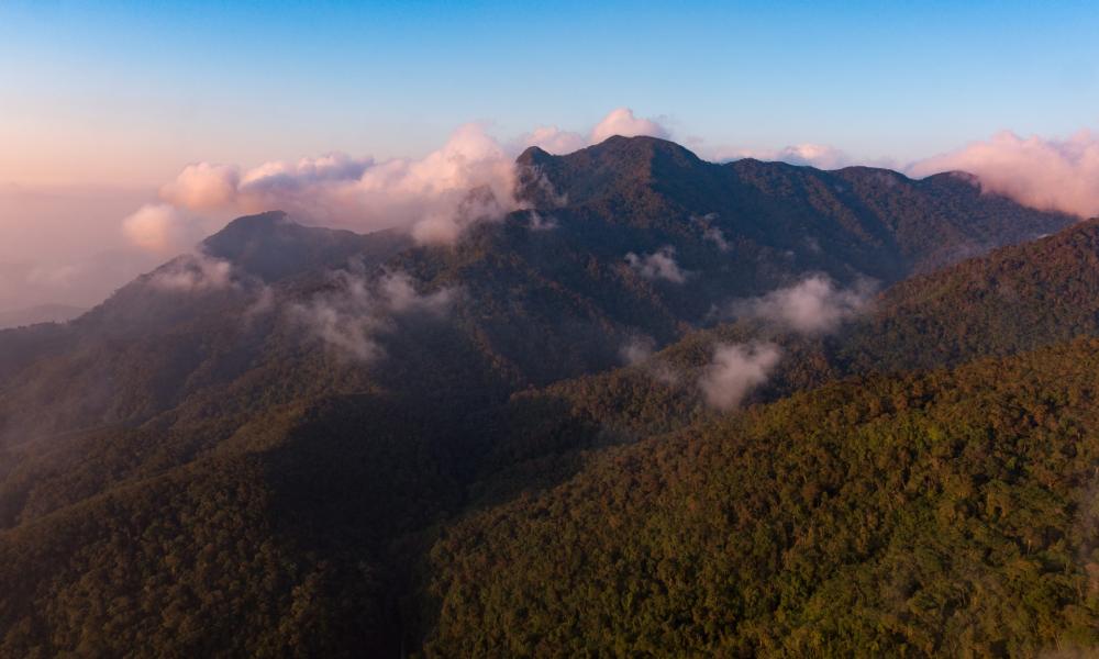 Aerial photograph of clouds and mountains in the Sierra Nevada de Santa Marta mountain rage of Colombia.