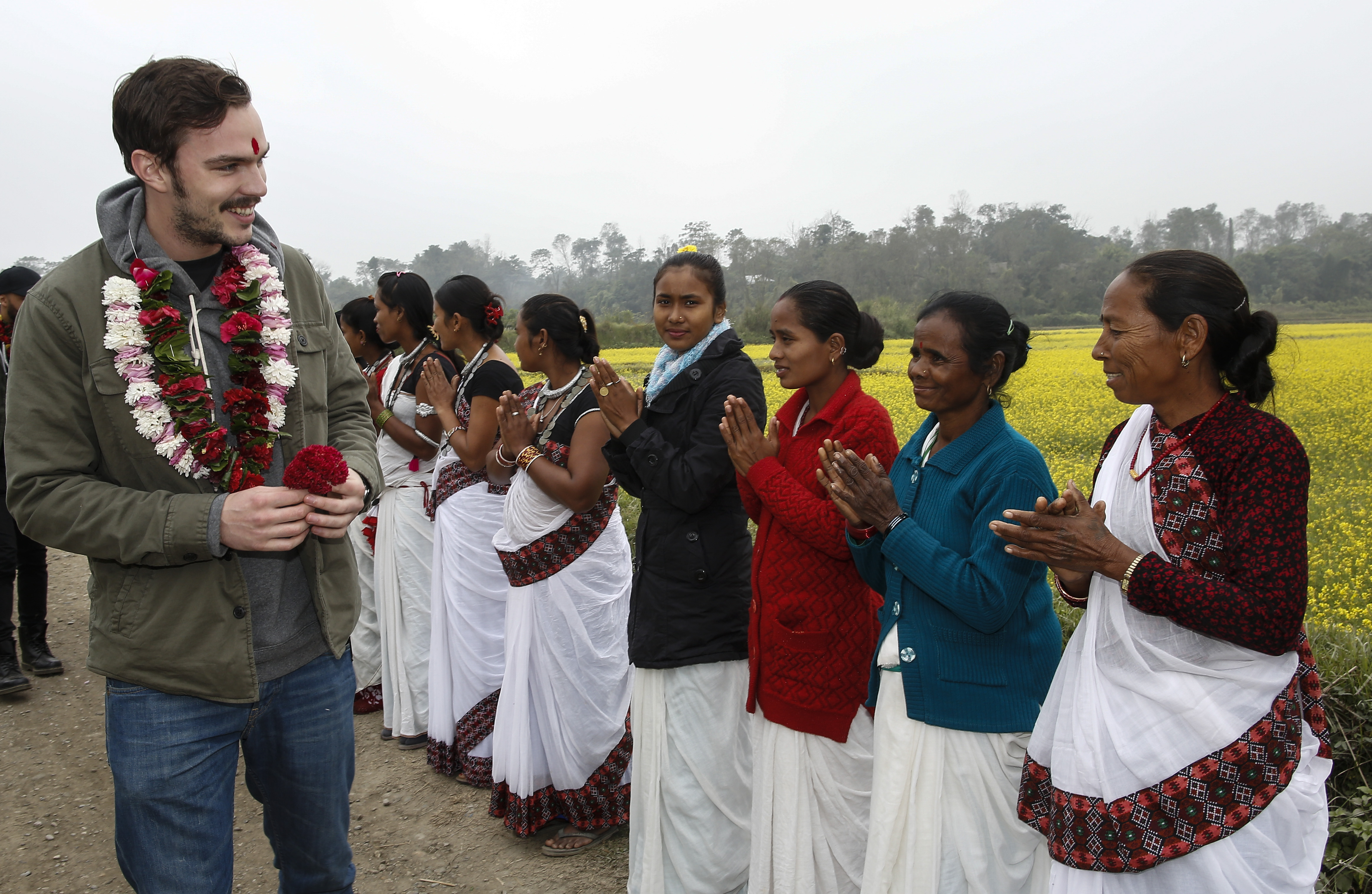 Nicholas Hoult visits local people 