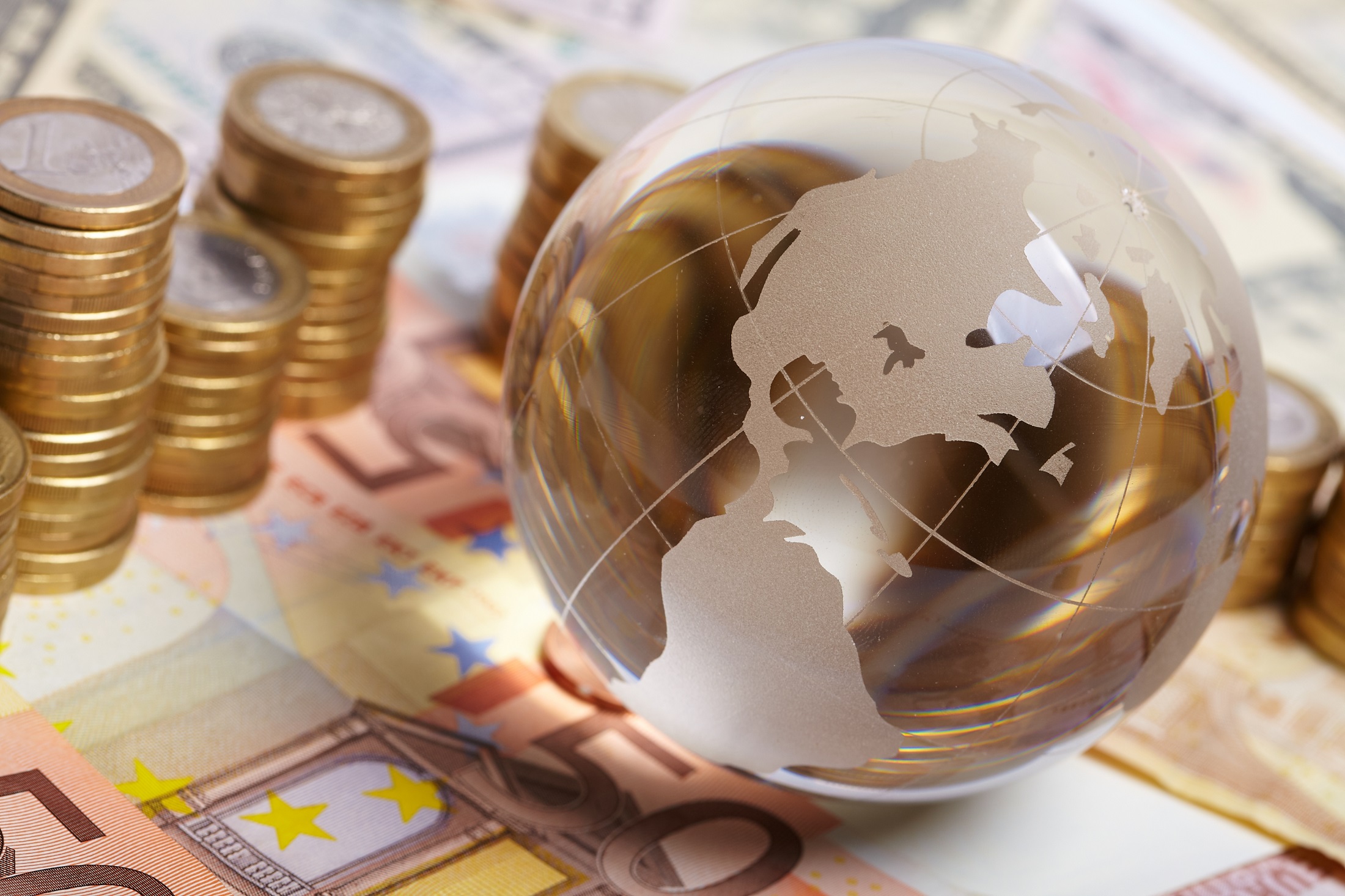 Currency and money on the table representing global investment and finance. Currency and money on the table representing global investment and finance.