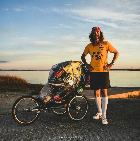 Rob Pope pushing a pram whilst running