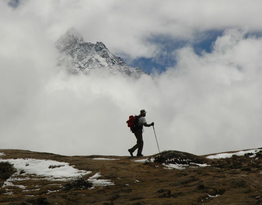 A lone trekker on a trail in the Himalayas near Mount Everest, Nepal.