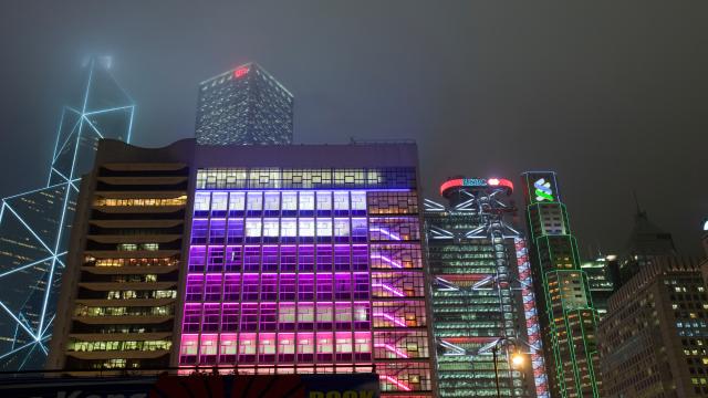 Office blocks lit up at night in Hong Kong, China.