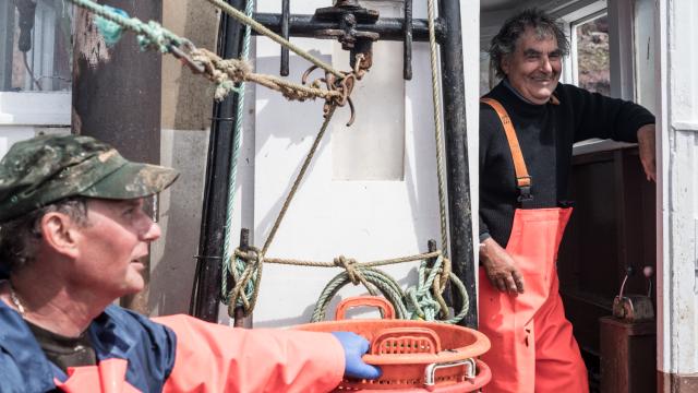 Fishermen on a boat off the Scottish coast