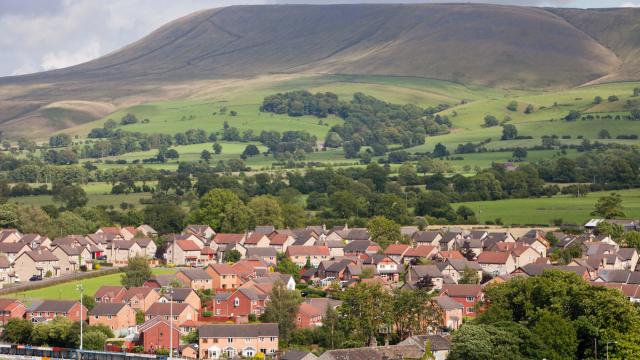 Houses on the outskirts of Clitheroe, Lancashire, UK, looking towards the surrounding countryside and Pendle Hill.