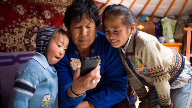 Nomadic herders using mobile phone