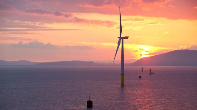 Coastal wind farm at sunset reversed