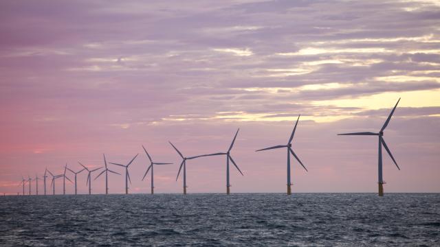 The Walney Offshore windfarm project, off Barrow in Furness, Cumbria, UK, at sunset.