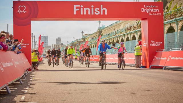 Cyclists at the London to Brighton Bike Ride Finish Line