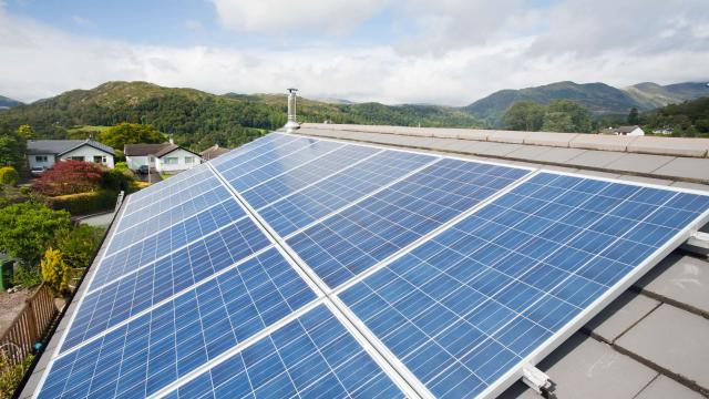 Close up of solar voltaic panels on a house roof in Ambleside, Cumbria, UK