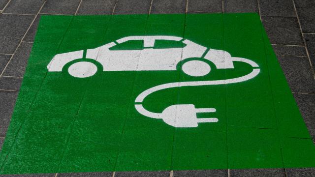 Green ground charging signage on parking bay