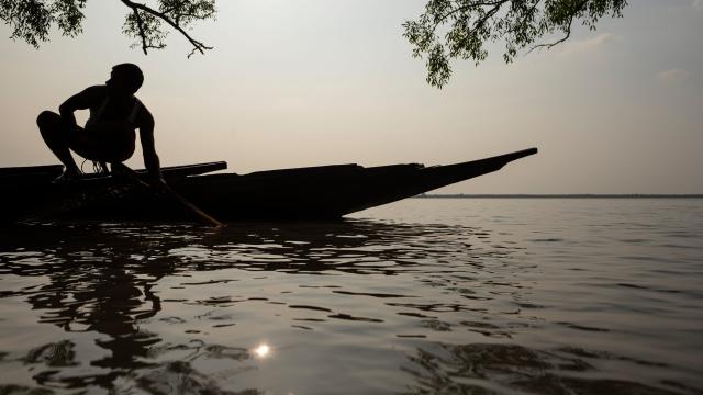 Silhouette of fisherman and boat