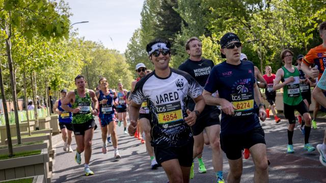 Runner at London Marathon smiling at camera