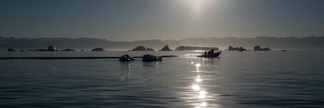 Speedboat in amongst icebergs in the Arctic