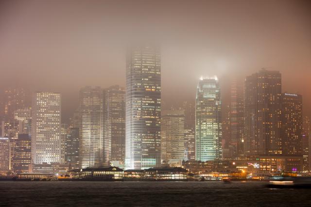 Office blocks lit up at night in Hong Kong
