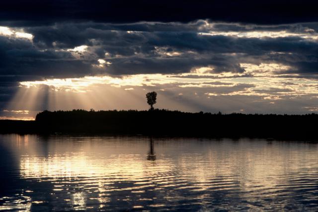 Sun shining through the clouds, Khingansky Zapovednik (Strict Nature Reserve), Amur floodplain. Far East. 
