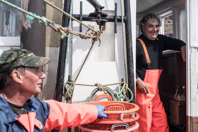 Fishermen on a boat off the Scottish coast