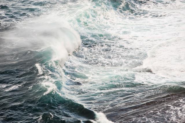 Waves crashing off Orkney in Scotland, UK. Orkney is leading the way in the testing of both tidal and wave energy devices.