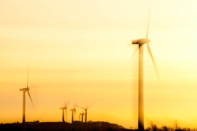 A windfarm on the west coast of Cumbria near Workington at sunset, UK.