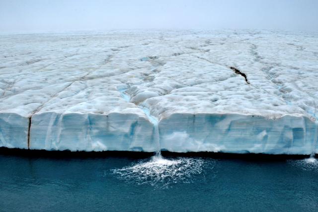 Waterfalls cascade from the Austfonna polar ice cap, Svalbard, Arctic