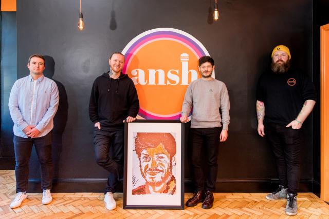 Nathan Wyburn reveals portait of Iwan Rheon at Ansh restaurant. 