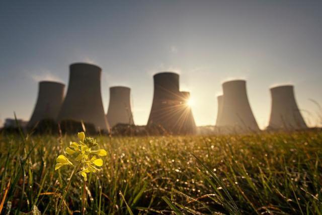 The sun rises behind the cooling towers of coal-powered Ratcliffe-on-Soar power station