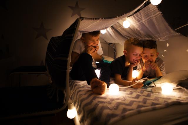 Boys in a homemade tent