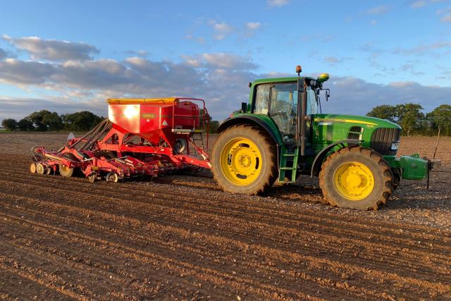 Tractor harvesting a field 