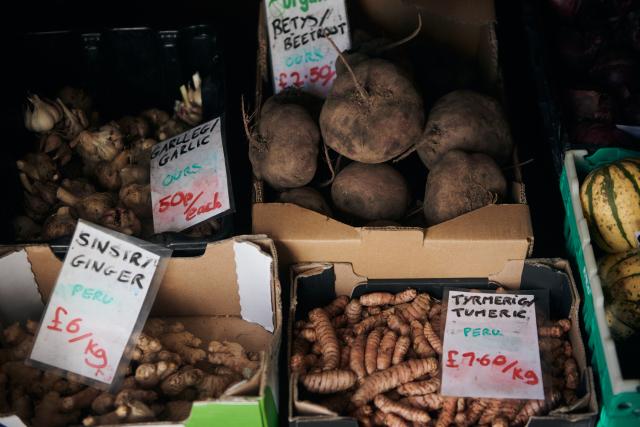 Produce for sale at Tyddyn Teg farm shop; including garlic, ginger, beetroot and turmeric.