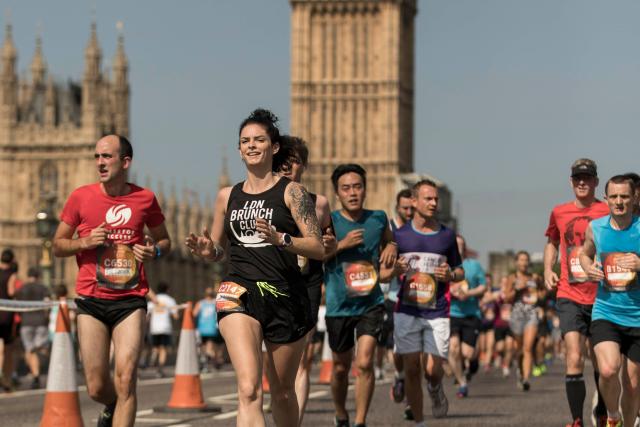 Runners passing over Westminster Bridge with Elizabeth Tower in the background