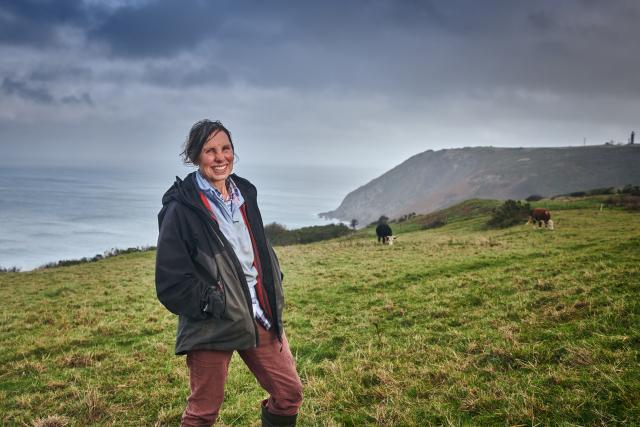 Liz on farmland close to the coast, Nantlyd farm.