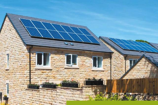 Cover image of Filling The Gap summary report. Image of new build homes with solar panels on the roofs