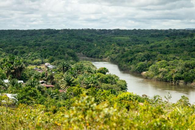 Aerial view of La Chorrera town and surrounding Amazon forest on the banks of the Igara Paraná River.