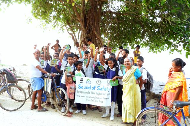 A group of school children in India holding a banner for 'Sound of safety' project