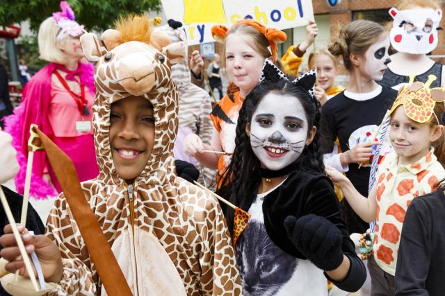 Group of children dressed up in animal fancy dress costumes