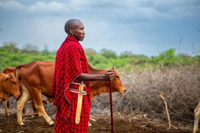Portrait of age group chief Taporu Lemanyi while standing in his boma. Embirika, Kajiado county, Kenya.