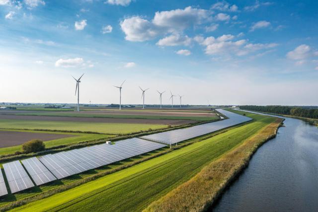 Solar panels and wind turbines generating renewable energy for green and sustainable future. Netherlands